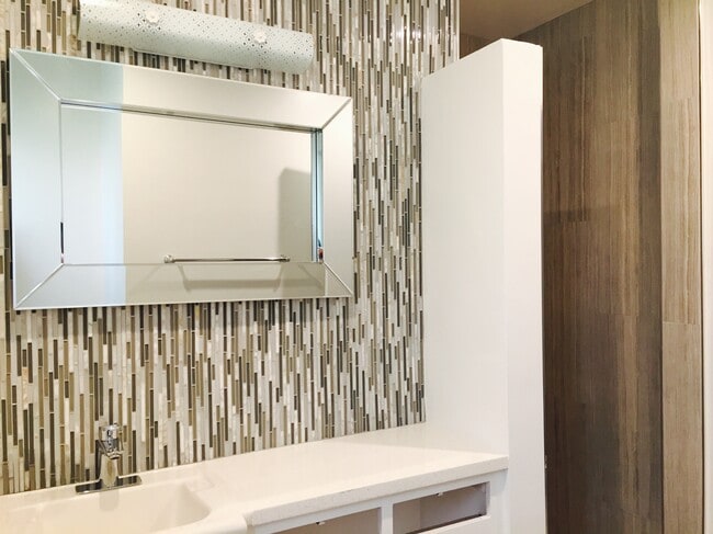 tiled master vanity wall and fixtures - 1214 Rutland Rd