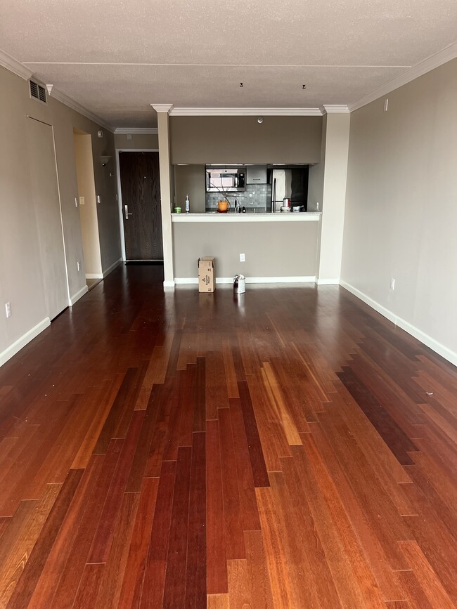 living room with cherry hardwood floors and crown molding - 4 Martine Ave