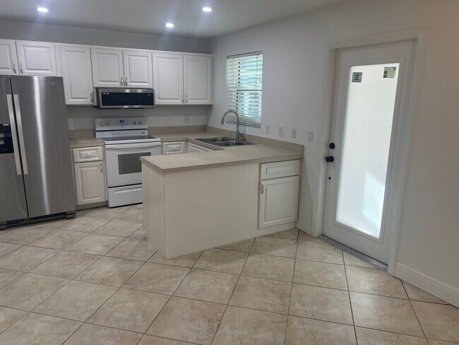 Kitchen and entry door - 1964 Alamanda Dr