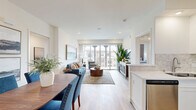 Located in San Diego, CA, this well-appointed 2-bedroom, 2-bathroom unit on the third floor offers a thoughtfully designed single-level layout. Warm hardwood-style flooring flows throughout the entire space, creating a cohesive and inviting atmosphere.

The open kitchen is a standout feature, showcasing crisp white shaker cabinetry, quartz countertops, a decorative tile backsplash, and a full suite of stainless steel appliances including a range, over-the-range microwave, dishwasher, and refrigerator. The kitchen connects seamlessly to the living area, which is bathed in natural light from large sliding glass doors that open to a private balcony overlooking the surrounding neighborhood.

The primary bedroom features natural light from a large window with views, while the second bedroom is equally well-lit with its own window. Both rooms are finished with the same hardwood-style flooring and include closet storage. Two dedicated hallways provide additional circulation and privacy between rooms.

The two bathrooms are finished with white cabinetry and quartz countertops. One bathroom includes a walk-in glass-enclosed shower, while the other features a vanity with ample storage. Two additional closets provide generous storage throughout the unit. The overall ambiance is clean, modern, and bright.