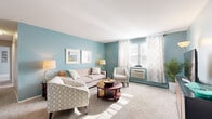 Located at 2184 Stratford Ave in Hatfield, PA, this single-floor, three-bedroom, one-bathroom home offers a well-organized layout with a cohesive, calming color palette carried throughout. The inviting living room features soft teal accent walls, plush carpeting, and generous natural light streaming through windows dressed with elegant patterned curtains, creating a warm and welcoming atmosphere. Adjacent to the living area, the dining space provides a cozy setting with carpeted flooring and a closet for added storage. The kitchen stands out with crisp white shaker cabinetry, light granite-style countertops, wood-look flooring, and black stainless appliances including a dishwasher, range, and microwave — all set against a teal backsplash wall for a modern touch. The spacious primary bedroom benefits from multiple windows offering abundant natural light, soft carpeting, and a serene grey-blue palette. The additional bedrooms are comfortably sized and well-lit. The full bathroom is neatly appointed with a white vanity, tile surround, and wood-look flooring. A connecting hallway ties the layout together efficiently, making this home a practical and comfortable residence in the heart of Hatfield, Pennsylvania.