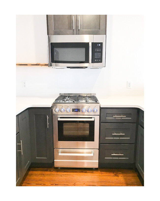 This photo was taken before we added the floating shelves next to the microwave (shown in next photo) - 18 W State St