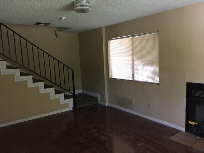 Large living room with ample light widow facing side garden and front lawn - 37 Fano St