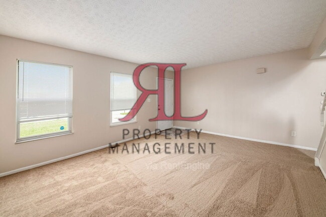 Building Photo - 7179 Feather Ct