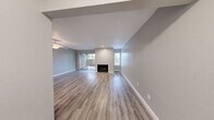 Located at 6380 Denton Way in Citrus Heights, California, this single-floor 1-bedroom, 1-bathroom residence offers a clean, modern aesthetic throughout. The open living area is a standout feature, highlighted by light wood-style flooring, neutral gray walls, a textured ceiling, and a fireplace that serves as a natural focal point. Sliding glass doors lead to a private outdoor patio, allowing natural light to fill the space and providing a seamless indoor-outdoor connection. A ceiling fan adds both function and comfort to the living area.

The kitchen is well-appointed with white cabinetry, granite-style countertops, a full suite of white appliances including an electric range and dishwasher, and recessed lighting overhead. The layout is efficient and practical, offering ample cabinet and counter space.

The bedroom is a comfortable, quiet retreat featuring the same wood-style flooring, soft gray walls, a textured ceiling, and a window that brings in natural light. A closet provides convenient storage within the room.

The bathroom continues the cohesive design language of the home, featuring a granite-topped vanity with white cabinetry, a large mirror, a tub-shower combination, and matching wood-style tile flooring. Clean white finishes and brushed nickel fixtures complete the polished look throughout.