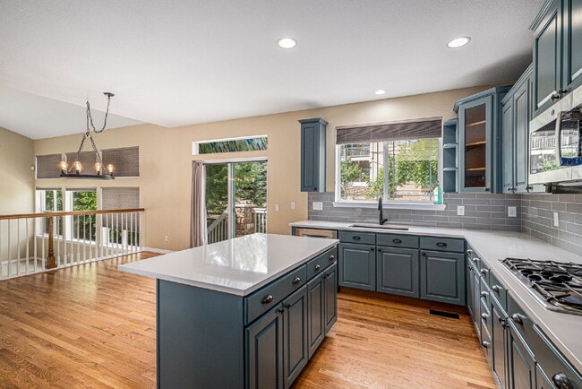 Photo - "Spacious 4-Bed Oasis with Granite & Hardwood Elegance at 8699 S Addison Way!" Apartment