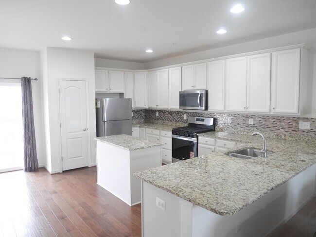 Building Photo - Beautiful 4-Bedroom Townhouse with Garage, Deck & Community Amenities