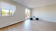 Located at 30 Campbell Crt in Stratford, Ontario, this well-appointed 2-bedroom unit offers a thoughtfully designed single-floor layout. Light hardwood-style flooring flows throughout, complementing the neutral, warm-toned walls and clean white trim found in every room.

The living room is generously sized and filled with natural light, courtesy of large sliding glass doors that open onto a private balcony with views of the surrounding neighbourhood. An additional window further enhances the bright, airy atmosphere of the space.

The kitchen is efficiently laid out in an L-shape, featuring crisp white cabinetry, light countertops, and tile flooring. Stainless steel appliances — including a full-size refrigerator, dishwasher, and range — provide modern functionality throughout.

Both bedrooms are well-proportioned with large windows that invite natural light and offer outdoor views. The primary bedroom is a comfortable size and includes a double closet with elegant arched-panel doors. The second bedroom also features a double closet, providing ample storage. Baseboard heating is present throughout the bedrooms and living areas.

A central hallway connects the rooms efficiently, and the unit's entry area offers a clean, welcoming transition into the living space. The overall ambiance is bright, clean, and move-in ready.