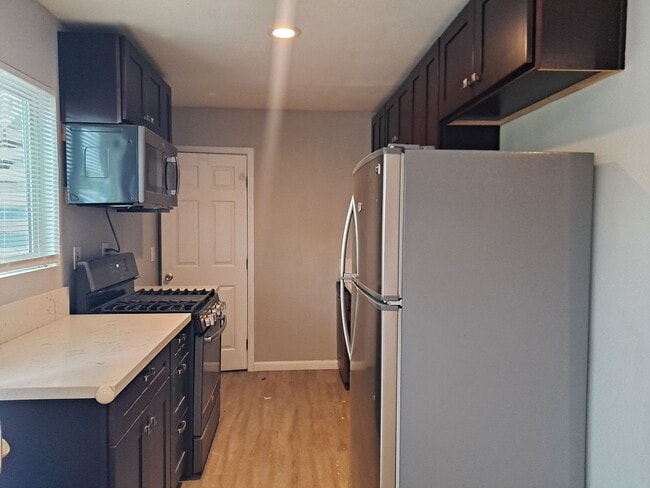 Building Photo - Spacious Studio with Assigned Parking Near...