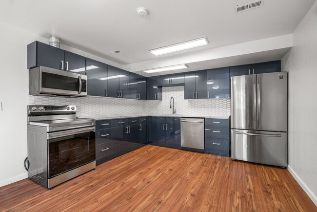 Open concept modern renovated high-end kitchen with all new stainless steel appliances - 411 124th St S