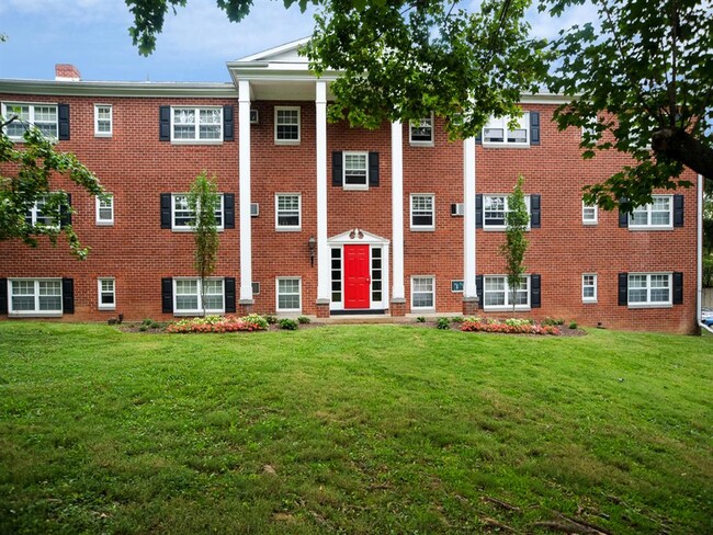 Classic and Tall, White Columns at Building Entrance - Society Hill at Lehigh Park