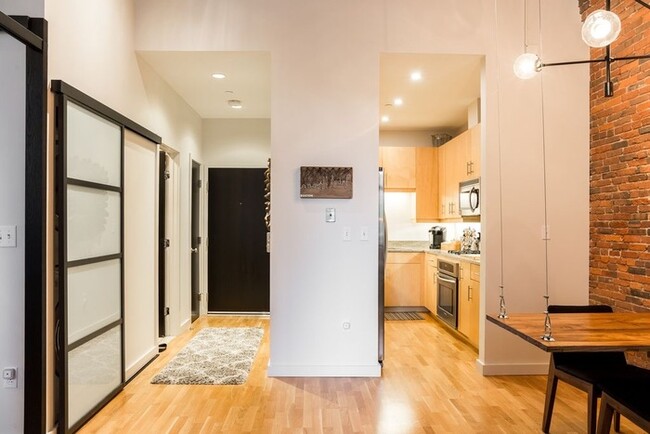 Building Photo - Professionally designed modern 1BR brick &...