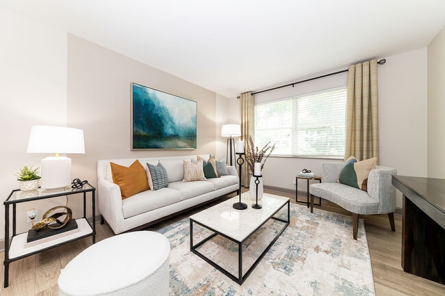 Spacious living room with hardwood-style flooring - Eastwood Greene