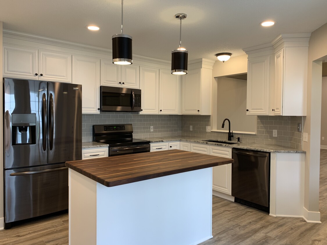 All new black stainless appliances, cabinets granite countertops and flooring - 9057 Prairieview Ln N