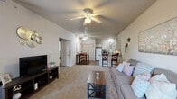 Located at 6626 Hedge Lane Ter in Shawnee, KS, this single-story, 3-bedroom, 2-bathroom home offers a functional and comfortable layout. The open-concept living room greets you with vaulted ceilings, a ceiling fan with light fixture, neutral carpet, and a large window that draws in natural light, creating an airy and welcoming atmosphere. The kitchen is efficiently designed with white cabinetry, gray laminate countertops, wood-look flooring, and white appliances including a dishwasher, electric range, microwave, and refrigerator. A peninsula counter with bar seating provides a casual dining option that connects seamlessly to the living area. The primary bedroom is a comfortable retreat featuring carpet flooring, a ceiling fan, a closet, and direct access to a private en-suite bathroom complete with a single vanity, cabinetry, and wood-look flooring. The additional bedrooms are well-proportioned, each with carpet, ceiling fans, and windows allowing natural light. The second full bathroom includes a tub/shower combo with sliding glass doors and wood-look flooring. A hallway and dedicated closet round out the interior. The layout is practical, with consistent neutral tones throughout creating a cohesive, move-in-ready feel.