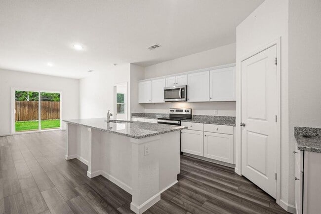 Building Photo - Backs to Wooded Area • Split Bedrooms • Modern & All-Electric