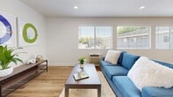 This well-designed 2-bedroom, 1-bathroom residence offers a comfortable and functional single-floor layout filled with natural light. The open-concept living and dining area features light wood-style flooring, neutral walls, and multiple windows fitted with blinds that frame views of the surrounding neighborhood. The space flows seamlessly into the kitchen, which is outfitted with crisp white shaker cabinetry, light stone countertops, and a full suite of stainless steel appliances including a refrigerator, gas range, and over-the-range microwave. Pendant lighting over the kitchen bar adds a polished finishing touch.

The primary bedroom is generously sized, complete with plush carpeting, a ceiling fan, and a sliding glass door that opens to a private outdoor balcony overlooking mature trees. A built-in closet with sliding doors and ample shelving provides practical storage. The second bedroom also features light wood flooring and a bright window, making it a versatile space suitable as a guest room or home office.

The bathroom includes a tub-shower combination with a sliding glass enclosure. A dedicated closet completes the layout. Throughout the residence, clean lines, a neutral color palette, and thoughtful design elements create a bright, move-in-ready living environment.