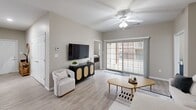 Located at 100 Big River Dr in Lake Saint Louis, MO, this well-appointed single-floor home offers 2 bedrooms, 3 bathrooms, a dedicated office, and a thoughtfully designed layout. The open-concept living area features light wood-look flooring, a ceiling fan, and a sliding glass door that invites natural light and outdoor views. The kitchen is outfitted with white cabinetry, stainless steel appliances, dark granite countertops, and a peninsula that transitions seamlessly into the dining area — an ideal setup for everyday living and entertaining. The dedicated dining room provides a defined space for formal meals, while the office features carpet flooring and a bright window overlooking the exterior. Both bedrooms are carpeted and include ceiling fans; the spacious primary bedroom offers two closets and direct access to a private bathroom. All three bathrooms feature white vanities with dark granite countertops and tub-shower combinations. The in-unit laundry room houses a full-size Whirlpool washer and dryer with wire shelving above for added storage. Two closets provide additional organization throughout the home. Neutral warm-beige tones and consistent finishes create a cohesive, move-in-ready atmosphere.