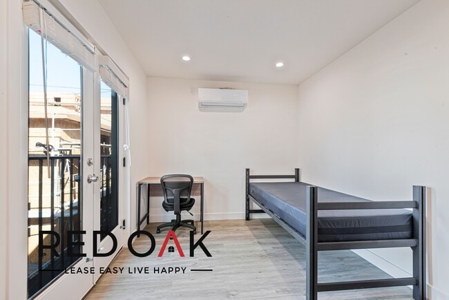 Building Photo - ~2 Months FREE~ Stunning Four Bedroom with...