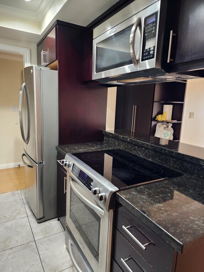 Kitchen/look thru to book shelf/cabinetry - 1517 E Garfield Ave