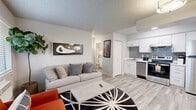 Located at 734 E Roger Rd in Tucson, AZ, this efficiently designed one-bedroom, one-bathroom unit offers a thoughtful layout across a single floor. Light wood-look flooring flows throughout the main living areas, creating a cohesive and clean aesthetic. The open-concept living room is bright and welcoming, featuring a large window that allows natural light to fill the space, a textured ceiling, and direct sightlines into the adjacent kitchen. The kitchen is well-appointed with white cabinetry, a gray subway tile backsplash, stainless steel appliances including a full-size range and refrigerator, and a single-basin sink. The bedroom is a comfortable, carpeted retreat with a window providing natural light, a wall-unit HVAC system, and an open closet with shelving. The bathroom includes a full tub-shower combination with a curved curtain rod, a single-sink vanity with white cabinetry, and wood-look tile flooring. Throughout the unit, the neutral gray and white color palette, modern fixtures, and efficient use of space make it a practical and stylish residence in Tucson.