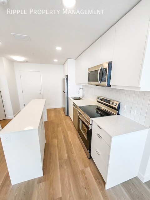 Photo du bâtiment - MODERN 1-BED CONDO | BELVEDERE PREMIER LIVING | SLEEK FINISHES