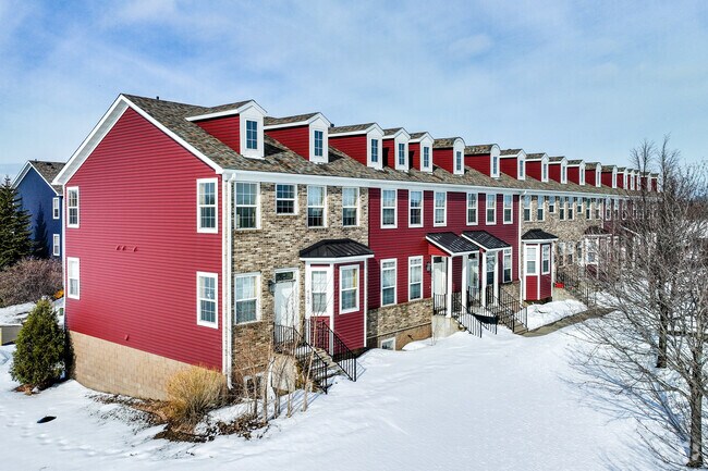 Townhomes with private garages sit adjacent to the city core of St. Michael.