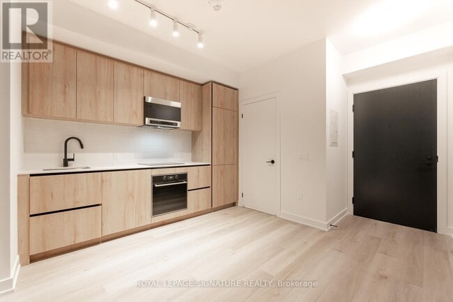 Photo du bâtiment - 117-1117 Broadway Ave