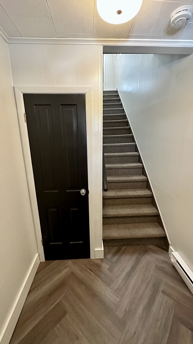 Stairs to apartment. Coat closet - 43 W Ludlow St