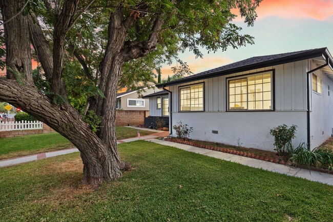 Building Photo - 6449 Woodlake Ave