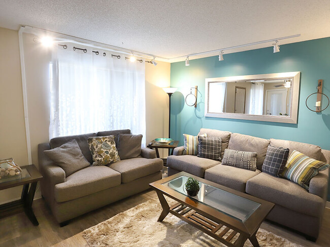 Spacious Living Room with Large Window - Berkshire Apartments and Townhomes