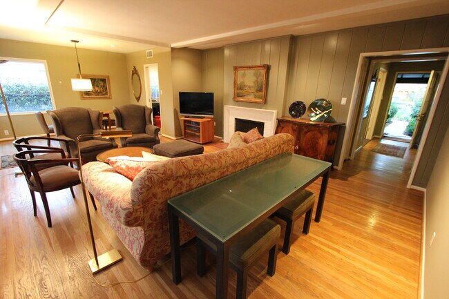 Living room with entryway and front door at right - 13403 Cumpston St