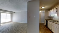 This single-floor residence offers a straightforward and functional layout designed to maximize usability throughout. The main living area is finished with wall-to-wall carpeting, creating a comfortable and warm atmosphere, while neutral gray walls provide a clean, versatile backdrop suited to a variety of furnishing styles. A textured popcorn ceiling adds a classic touch overhead, and recessed air vents ensure consistent climate control throughout the space.

A structural column visually divides the living area, adding architectural character while subtly defining separate zones within the open floor plan. Light switch panels and electrical outlets are conveniently positioned along the walls, reflecting a practical approach to the layout.

Transitioning toward the rear of the unit, the flooring shifts to a warm hardwood-style surface, guiding the eye down a well-lit hallway. Flush-mount ceiling light fixtures provide consistent illumination throughout the corridor. At the end of the hallway, a glimpse of cabinetry suggests the presence of a kitchen or utility area, hinting at additional functional spaces beyond. The overall ambiance is clean, neutral, and move-in ready, offering a blank canvas for personalization.