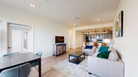 Located at 431 Picadilly Road in Aurora, CO, this well-appointed 2-bedroom, 2-bathroom single-story home offers a thoughtfully designed open-concept layout with modern finishes throughout. Light wood-tone flooring flows seamlessly across the living areas, creating a warm and cohesive feel.

The living room is bright and welcoming, connecting directly to a dedicated dining area and a well-equipped kitchen. The kitchen features granite countertops, grey-toned cabinetry with black hardware, black appliances, and recessed lighting with pendant accents, offering both functionality and style. Louvered closet doors adjacent to the kitchen provide generous pantry and storage space.

The primary bedroom is generously sized, featuring dual windows that invite natural light and outdoor views, a ceiling fan, and direct access to a private en-suite bathroom. The second bedroom is equally comfortable, also with a ceiling fan. Both bathrooms are finished with granite-topped vanities, grey cabinetry, and tub-shower combinations with light wood-tone flooring.

A dedicated laundry room houses a full-size side-by-side washer and dryer with overhead shelving for additional storage. Two closets, a hallway, and a utility room round out this efficient and complete floor plan, making it a highly functional home.