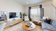 Located in Traverse Mountain, Lehi, Utah, this one-bedroom, one-bathroom residence offers a thoughtfully designed single-floor layout with modern finishes throughout. The open-concept living and dining area is anchored by large windows that frame sweeping views of the surrounding Lehi landscape, flooding the space with natural light. Light-toned hardwood-style flooring runs through the main living areas, complementing the clean white walls and contemporary aesthetic.

The kitchen is sleek and functional, featuring white cabinetry, light countertops, a soft blue subway tile backsplash, and a full suite of stainless steel appliances including a range, over-the-range microwave, and refrigerator. The galley-style layout maximizes efficiency while maintaining an open connection to the rest of the unit.

The bedroom is a comfortable retreat, offering plush carpeting, a large window with views, and a dedicated closet for storage. The room provides ample space for a full bedroom suite. The bathroom continues the clean, modern design language with light wood-style flooring, a neutral countertop vanity, and a shower-tub combination. Throughout the residence, recessed lighting and a crisp white palette create a bright, airy ambiance that feels both contemporary and welcoming.