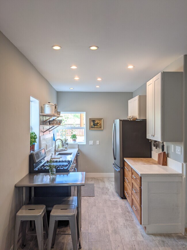 Kitchen, gas stove and motion Faucet. - 948 N 10th Ave