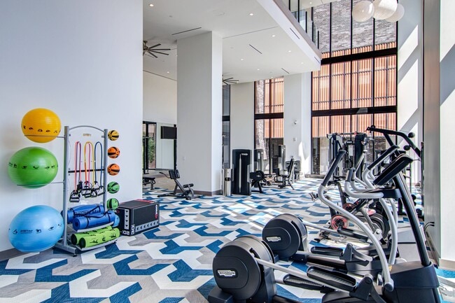 It looks good from up here. Two story gym with Peloton bikes. - Ascent Midtown