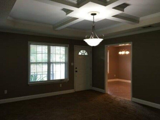 Building Photo - Spacious 3BR Brick Home with Open Split Floor Plan & Tiled Back Porch on Nearly an Acre