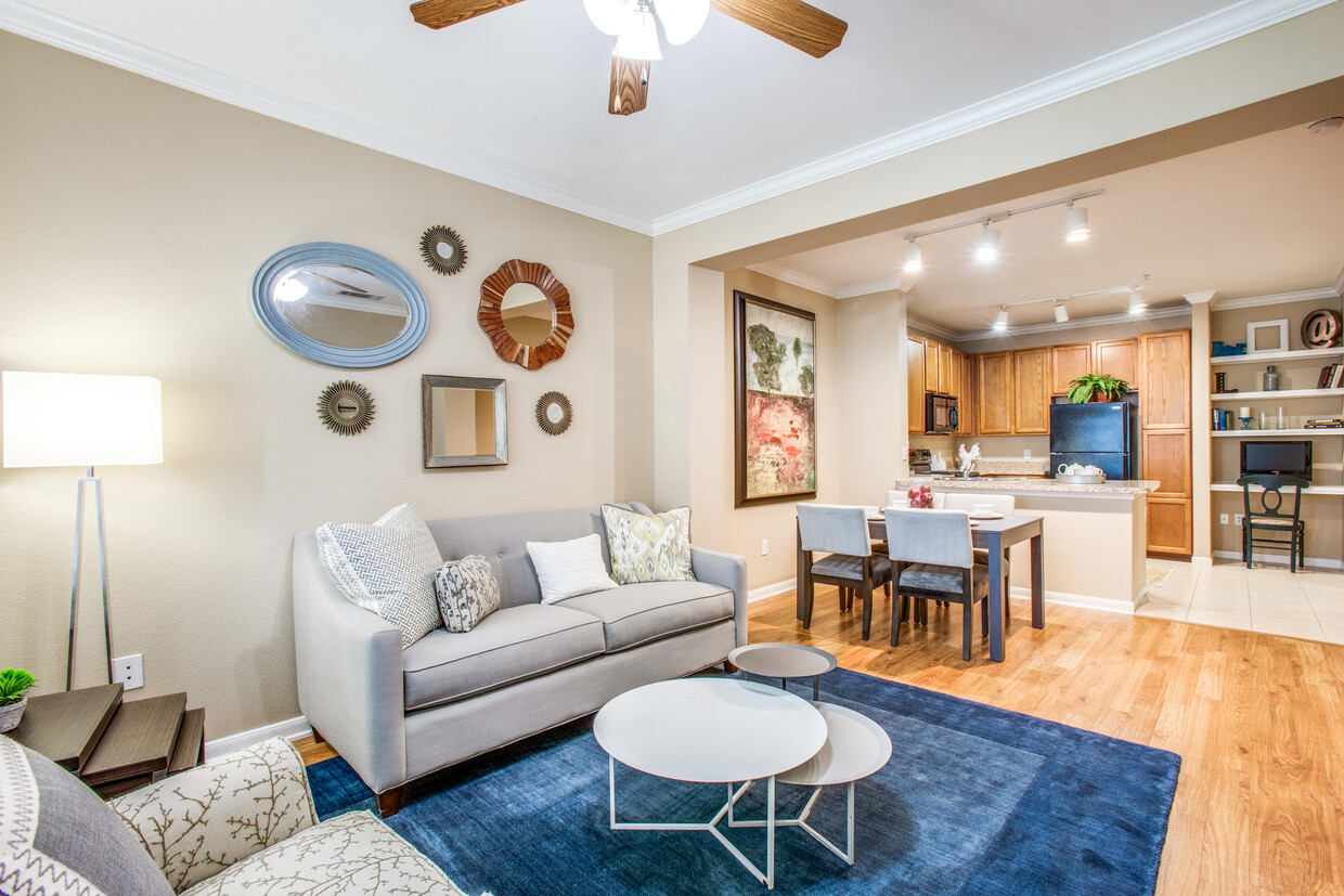 Fully decorated living room with laminate flooring - The Lodge at Spring Shadows