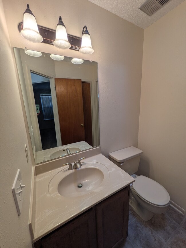 A half bath access from each bedroom ( also one of them has a hallway access) - 1501 Green Acres Blvd