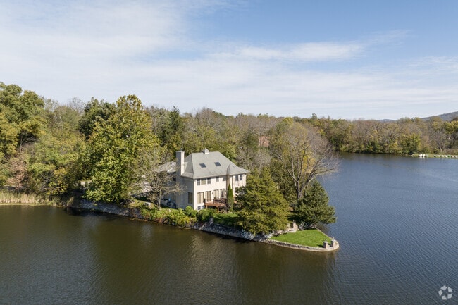 A lake house sits on its own promontory at Vernon Valley Lake in Vernon Township, NJ.