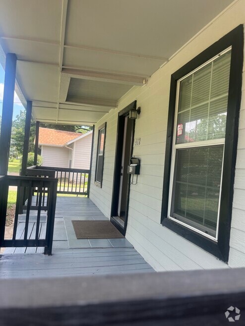 Porch under a big tree. - 412 S O Connor Rd