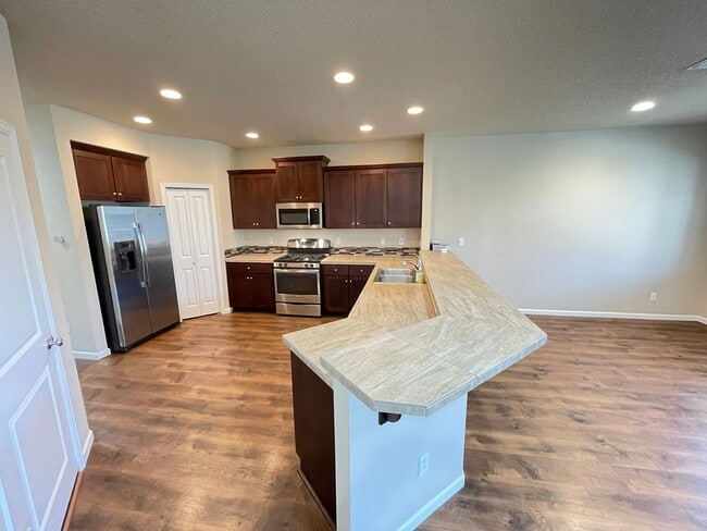 Building Photo - Spacious 4-Bedroom Home with Inviting Curb...