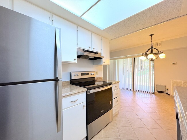 Building Photo - Welcome to this beautifully maintained first-floor condominium offering 2 bedrooms and 2 full bat...