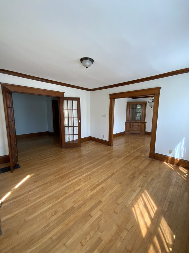 Living room into dining and entry - 155 Federal St