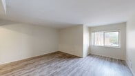 Located at 1045 E Woodward Heights Blvd in Hazel Park, Michigan, this single-floor, 2-bedroom, 1-bathroom unit offers a practical and well-organized layout. The living and dining area is a combined open space finished with light-toned luxury vinyl plank flooring that runs throughout the main areas, creating a clean, cohesive aesthetic. Natural light enters through a large window, brightening the neutral cream-colored walls and enhancing the airy feel of the space. The kitchen is efficiently designed in an L-shaped configuration, featuring white shaker-style cabinetry, stone-patterned laminate countertops, a stainless steel sink, and a stainless steel range, offering ample storage and workspace. A hallway connects the living area to the private quarters, flanked by closets for additional storage. Both bedrooms are carpeted and receive natural light through windows. The primary bedroom is notably spacious and includes two closets, providing generous storage. The second bedroom also benefits from its own window with outdoor views. The full bathroom is clean and functional, equipped with a tiled tub/shower combination. Throughout the unit, the consistent use of light colors and updated finishes contributes to a bright and move-in-ready atmosphere.