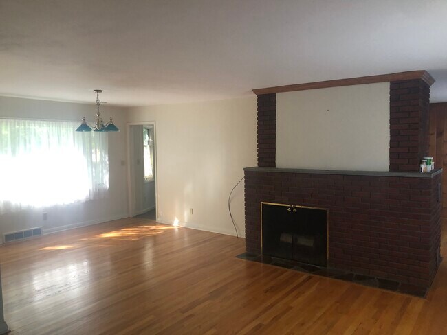 Living room with fireplace/ dining room - 955 Meadowbrook Dr