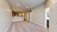 Located at 1106 Continental Ave in Coatesville, PA, this two-bedroom, one-bathroom home offers a well-designed layout with modern finishes throughout. The open-concept living area features neutral-toned carpet and recessed lighting, flowing seamlessly into the kitchen via a convenient pass-through counter. The kitchen is well-appointed with rich, dark-toned cabinetry, white countertops, light hardwood-style flooring, and a full suite of stainless steel appliances including a gas range, built-in microwave, and refrigerator. The primary bedroom is generously sized, offering ample space and carpet flooring, while the second bedroom benefits from dual windows that invite natural light and views of the surrounding neighborhood. The full bathroom features hardwood-style flooring, a dark wood vanity with a white countertop, and a bright window for natural ventilation. A dedicated laundry room houses a full-size washer and dryer with wire shelving above for added storage. Two closets with wire shelving systems provide excellent organization throughout the home. A hallway connects all rooms with a practical and efficient flow, completing this thoughtfully arranged living space.