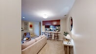 Located at 201 Remington Cir in Schaumburg, IL, this thoughtfully designed single-floor residence offers two bedrooms, two full bathrooms, a dedicated office, and in-unit laundry — all within a comfortable and efficiently laid-out floor plan. The open-concept living and dining area is bright and welcoming, featuring neutral tones, plush carpeting, and seamless flow into the kitchen, which is outfitted with rich wood cabinetry, white countertops, and a full suite of stainless steel appliances including a range, microwave, dishwasher, and refrigerator. The primary bedroom is generously sized with soft carpet flooring and ample closet space, while the second bedroom offers natural light through a large window and its own closet. The dedicated office includes a ceiling fan and a bright window overlooking the outdoors, making it ideal for working from home. Both bathrooms feature warm wood cabinetry and classic white tile finishes, with one including a tub-shower combination. The in-unit laundry room provides added convenience with overhead cabinetry for storage. Throughout the home, warm beige walls, neutral flooring, and consistent wood-toned accents create a cohesive and inviting atmosphere.