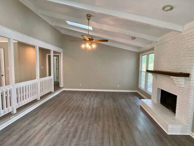 Living Room with Sky Lights and Fireplace - 2908 Jimamie Ln